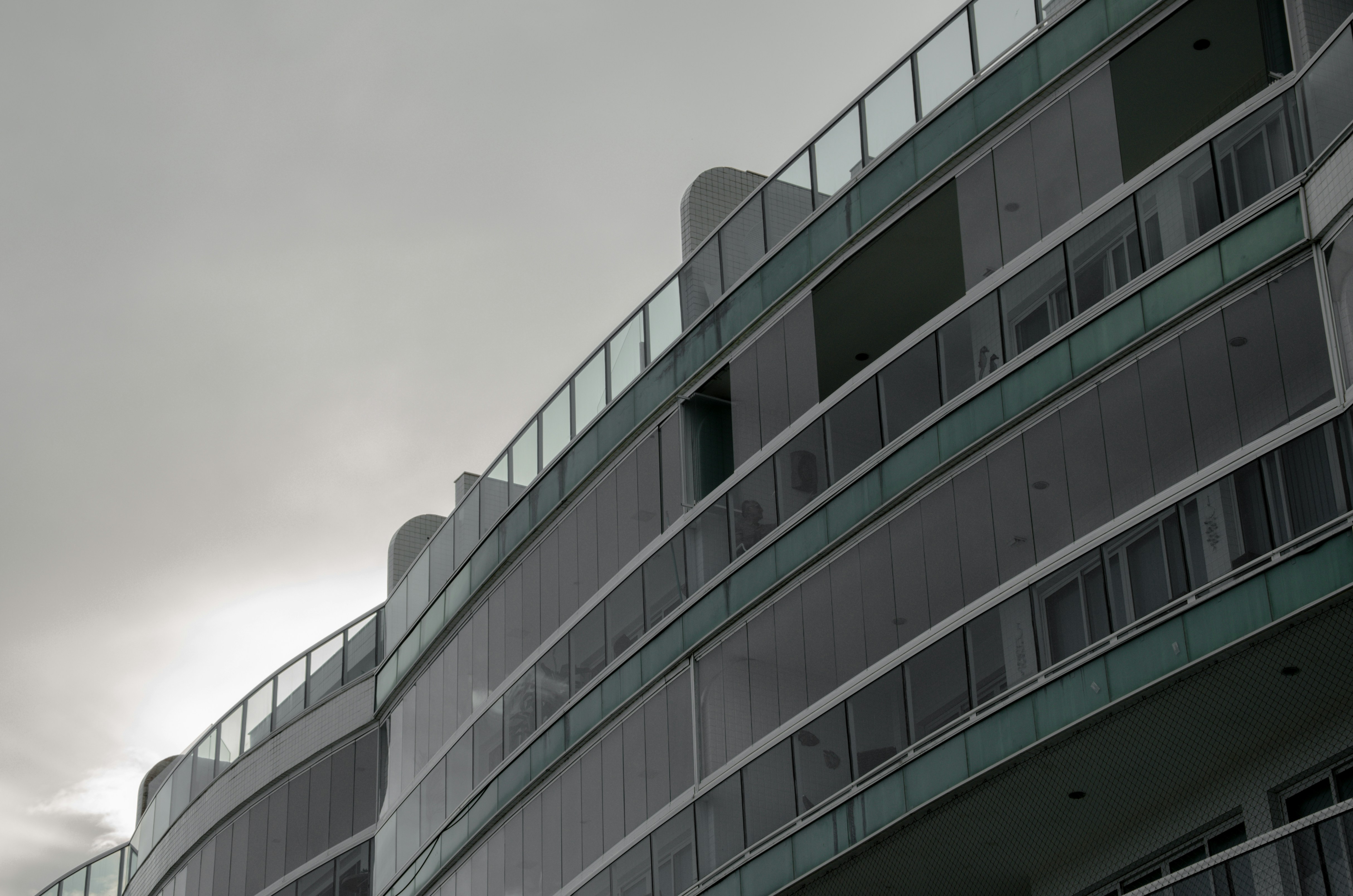 a tall building with balconies on top of it