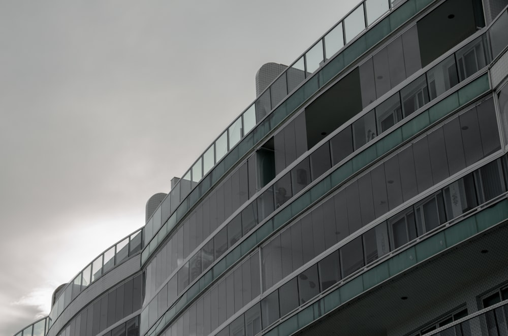 a tall building with balconies on top of it