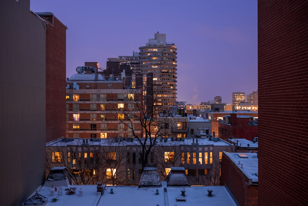 a view of a city at night from a rooftop