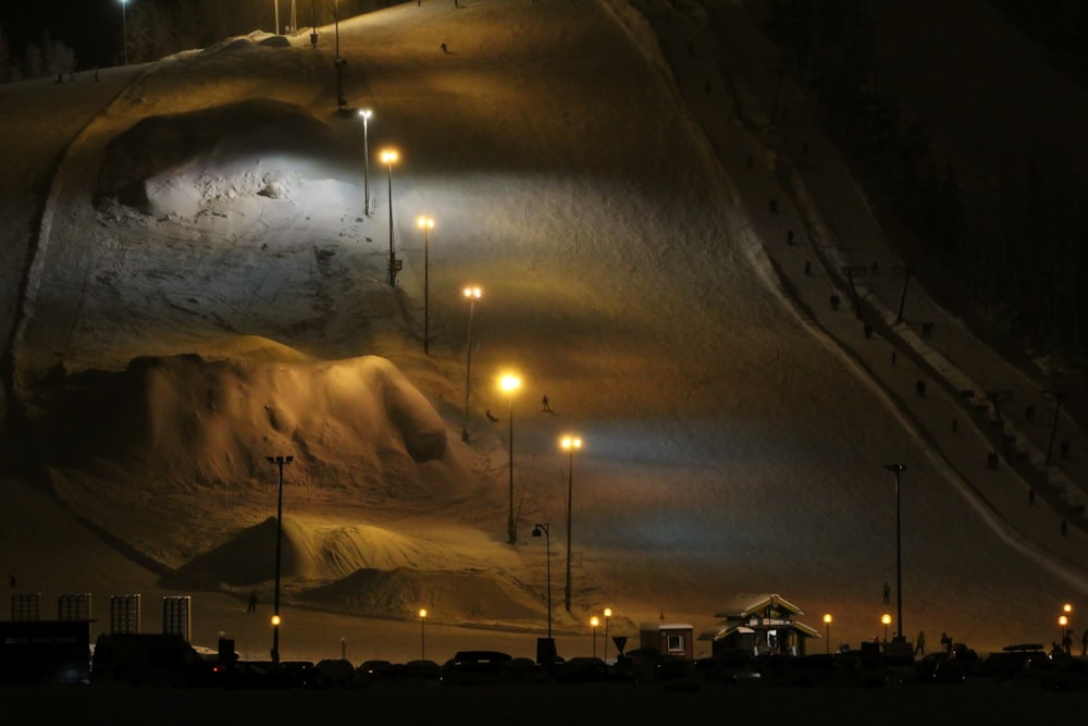 a night scene of a snow covered hill