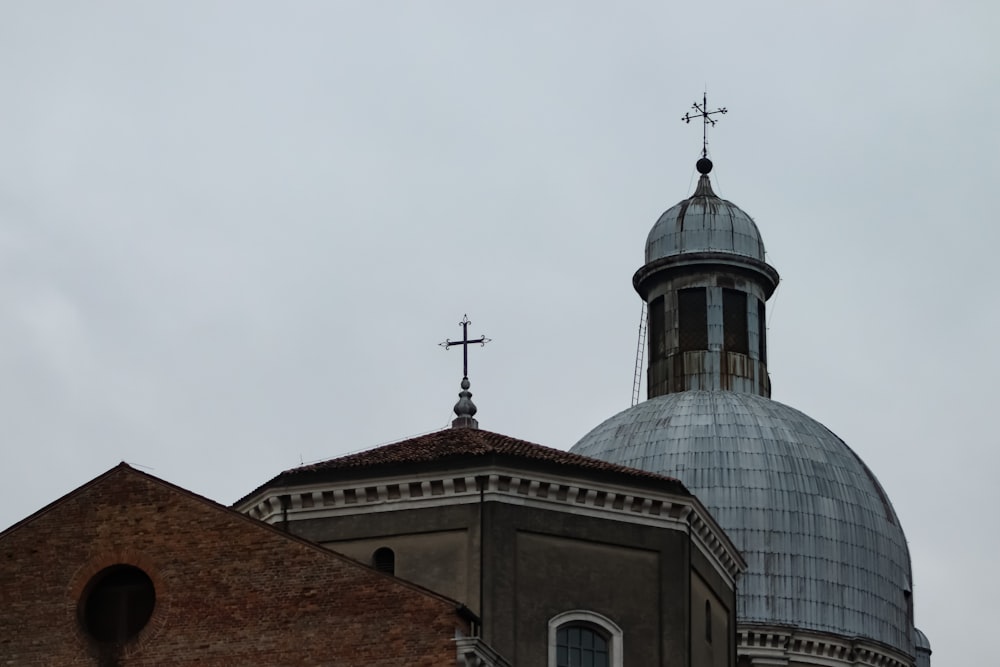 a church steeple with a cross on top