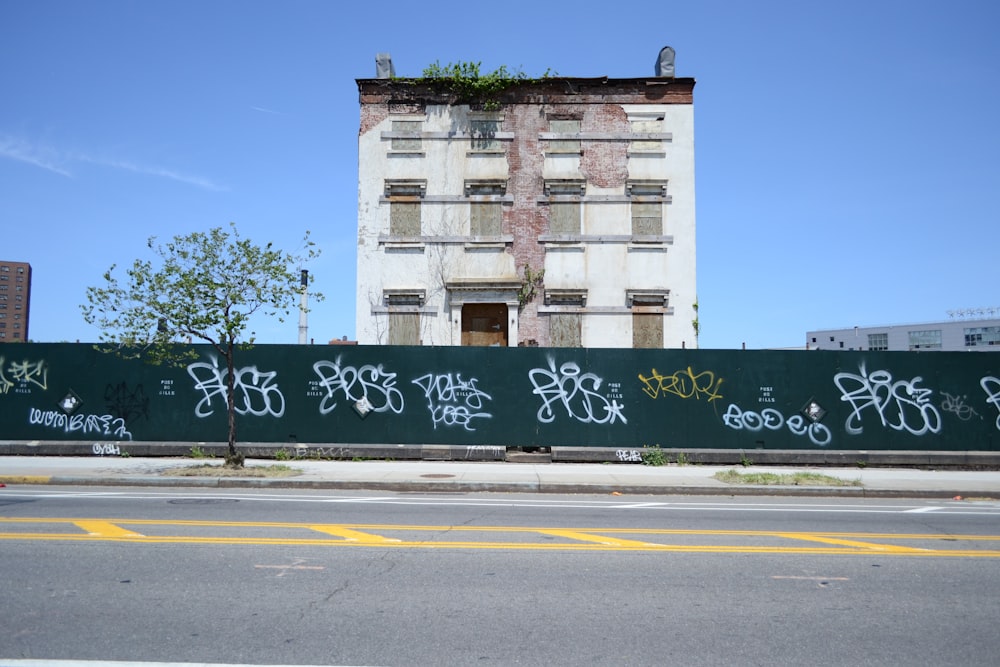 a large building with graffiti on the side of it