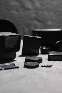 A vibrant display of various GoPro cameras and mounts arranged on a wooden table, ready for action.