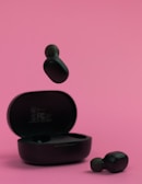 A wireless earbud set in a sleek charging case.