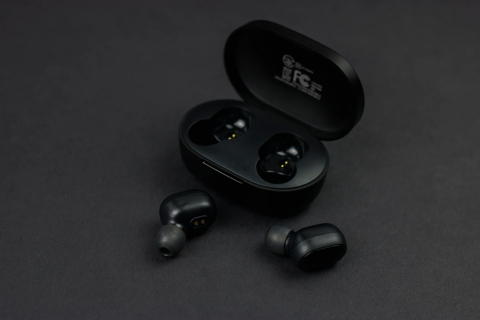 a pair of earbuds sitting on top of a table