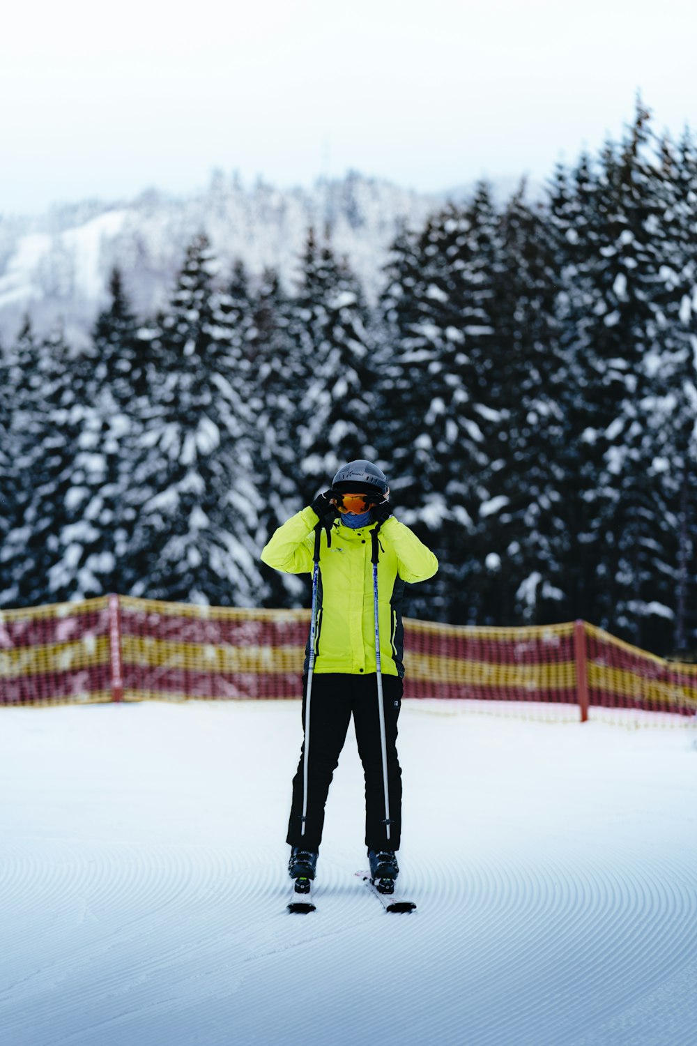 a person standing on skis in the snow