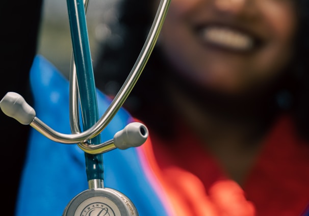 a woman holding a stethoscope up to her face