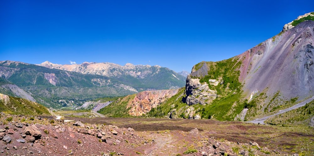 a view of a mountain range from a trail