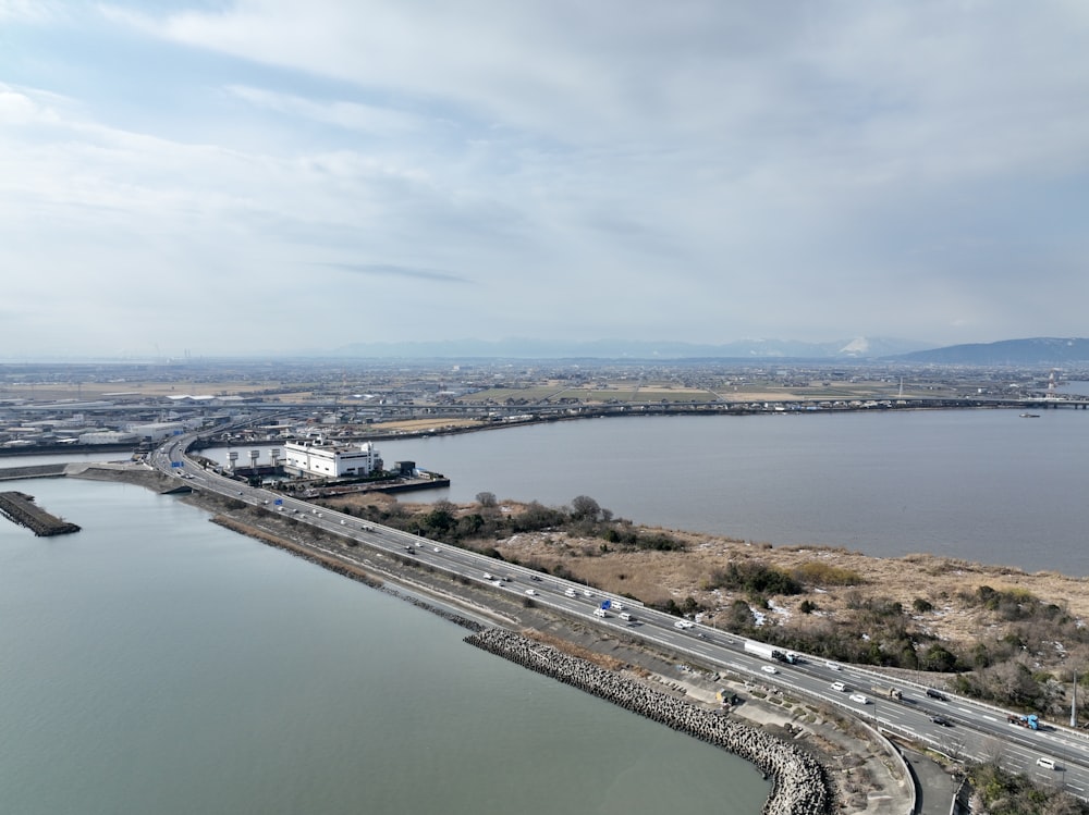 a large body of water next to a highway