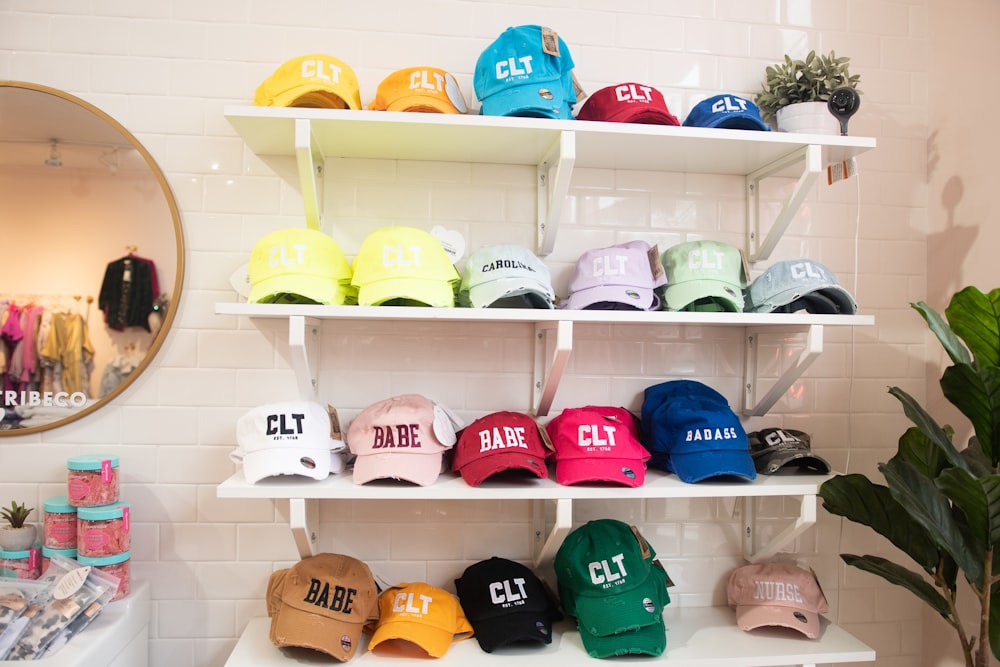 a wall of hats on shelves in a store