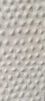 a black and white photo of a white wall