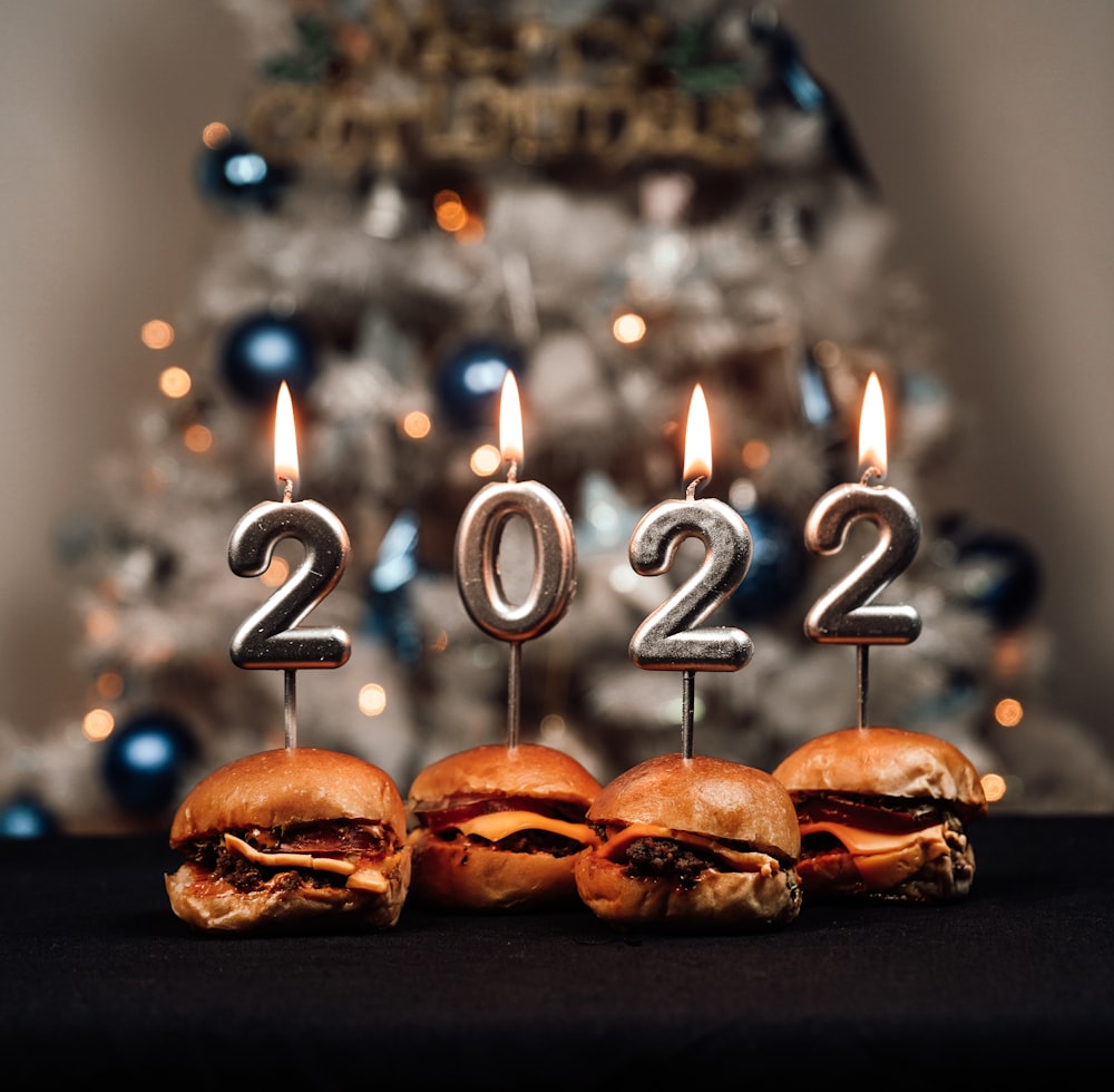 a group of three hamburgers sitting on top of a table