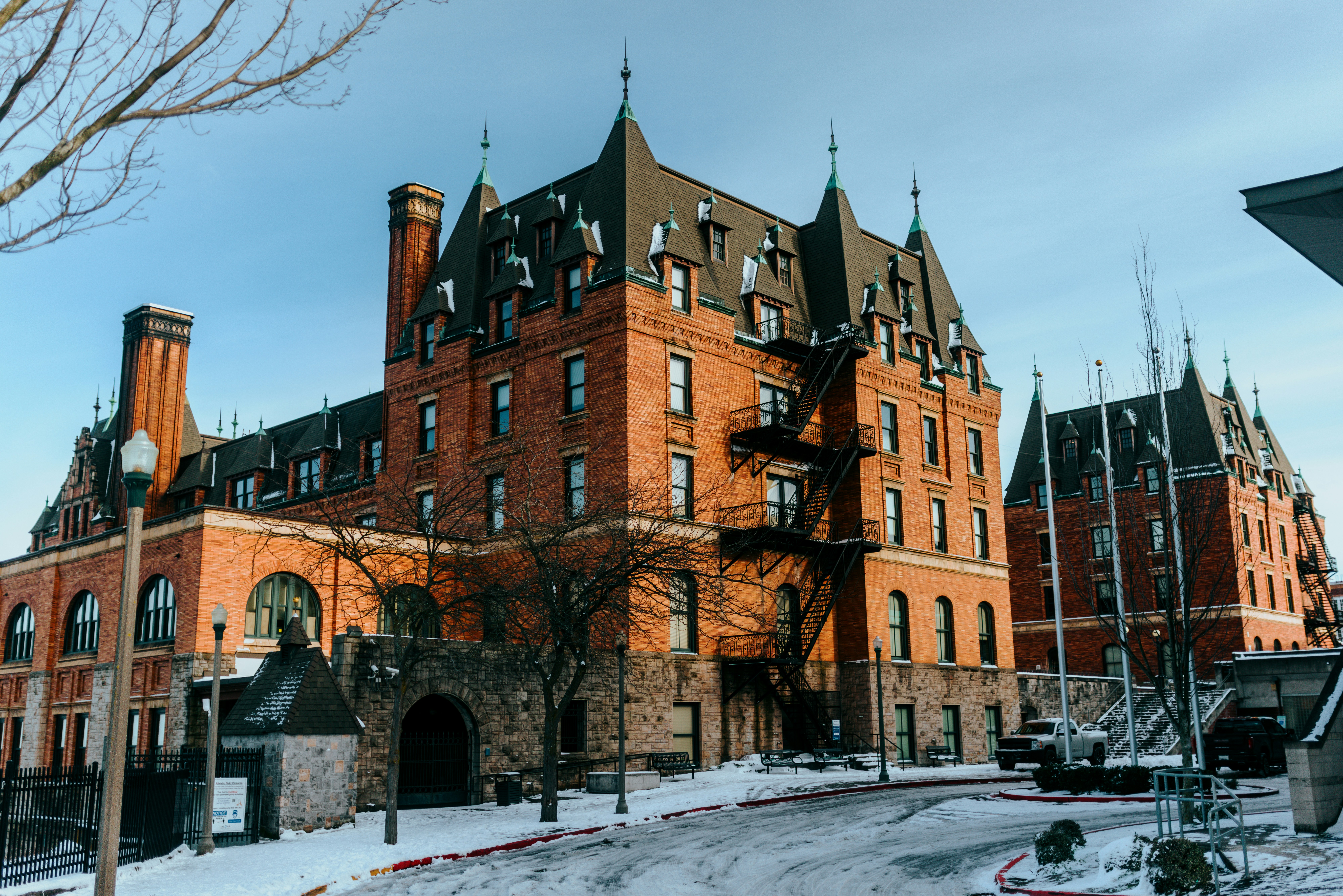 a large red brick building with a clock tower