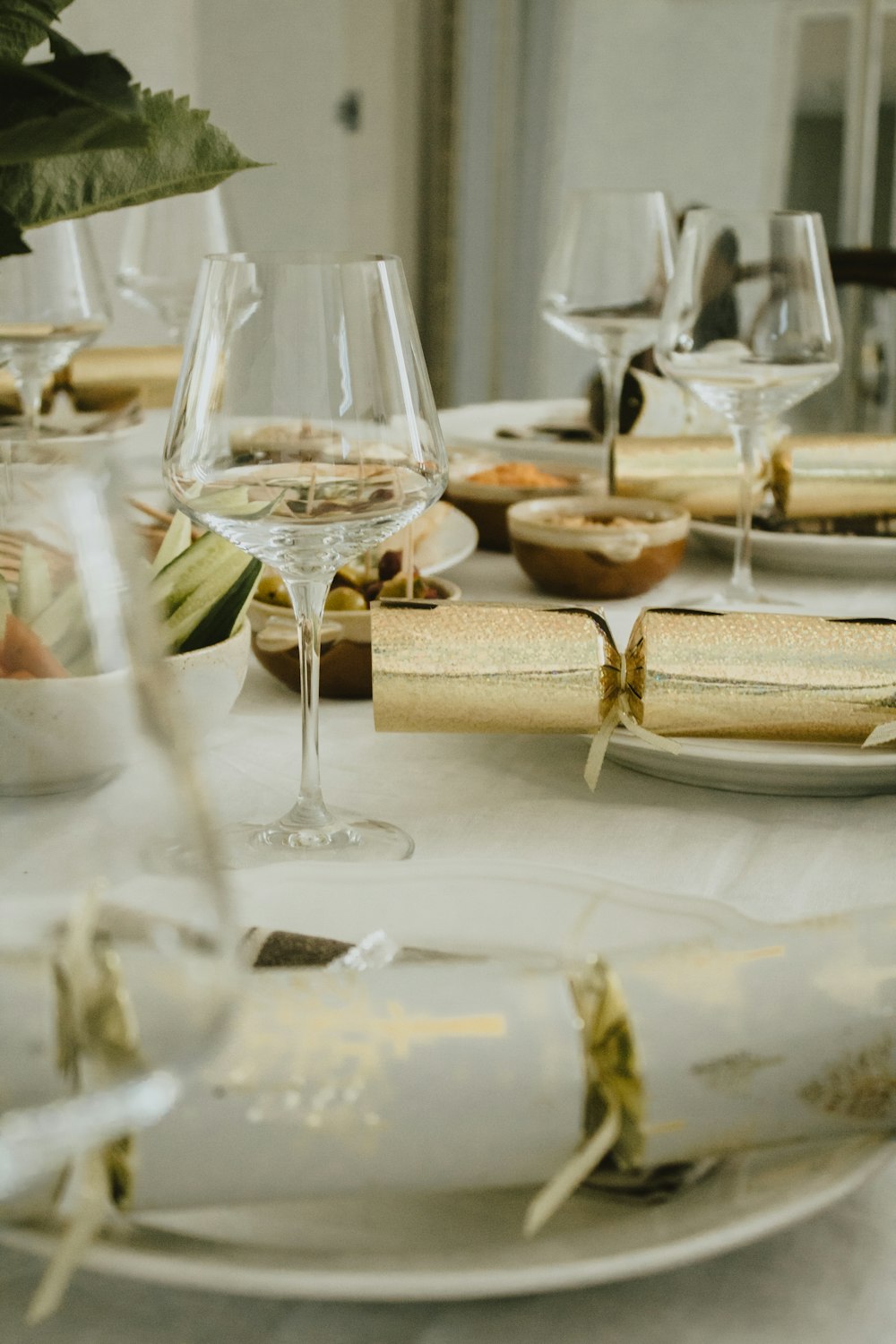 a white table topped with lots of glasses of wine