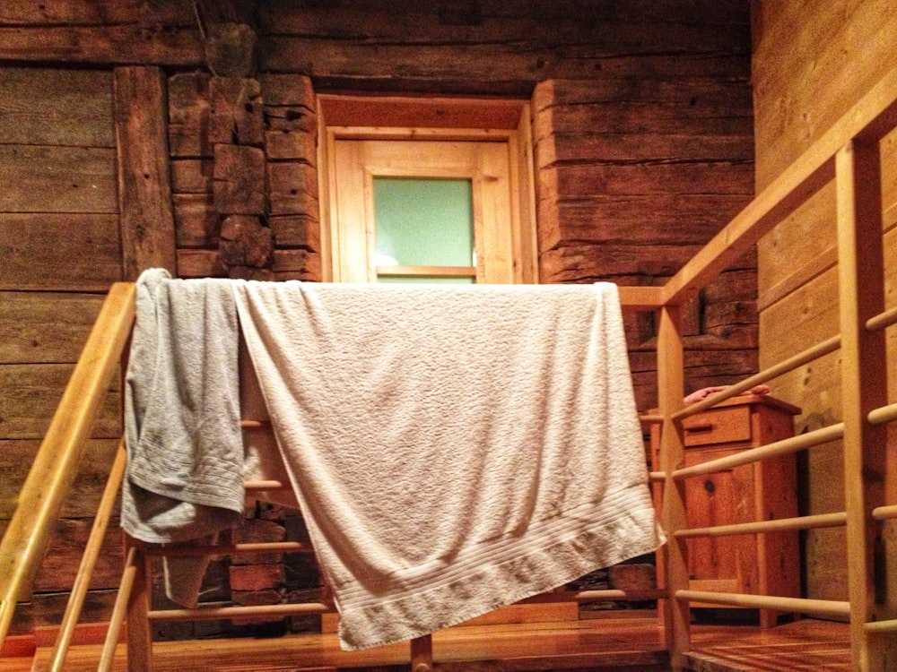 a towel hanging on a clothes line in a cabin
