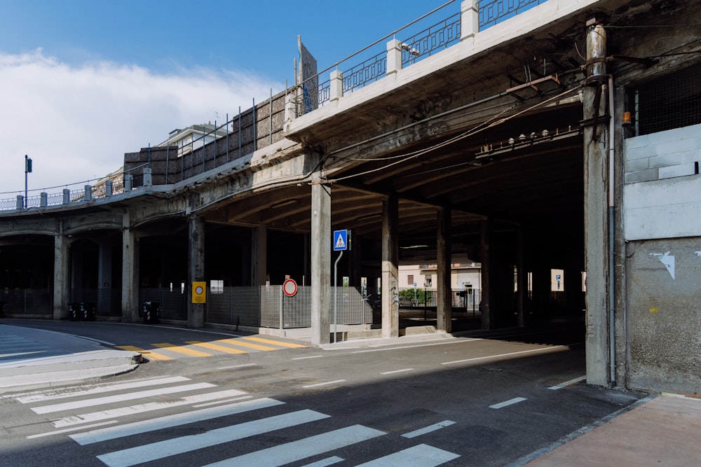 an empty parking garage on the side of a road