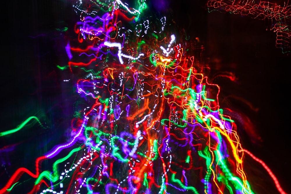 a colorful display of lights in the dark