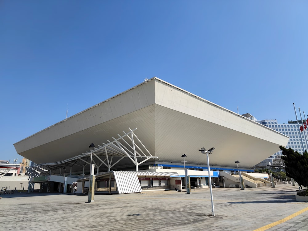 a large white building with a metal roof