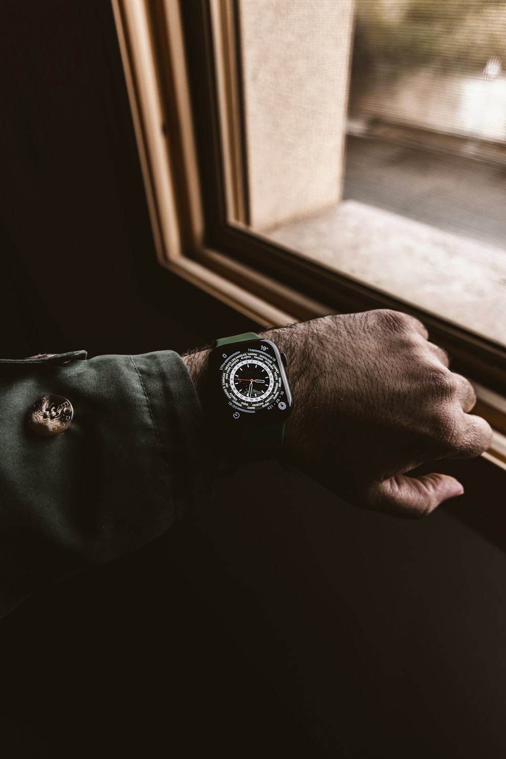 a man's hand with a watch on his wrist