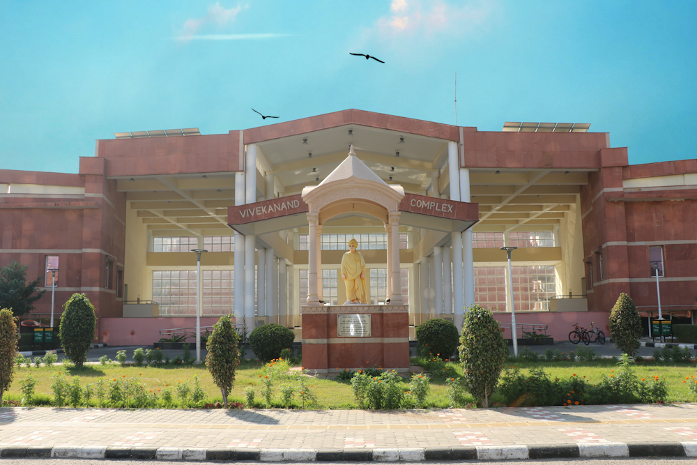 a large building with a statue in front of it