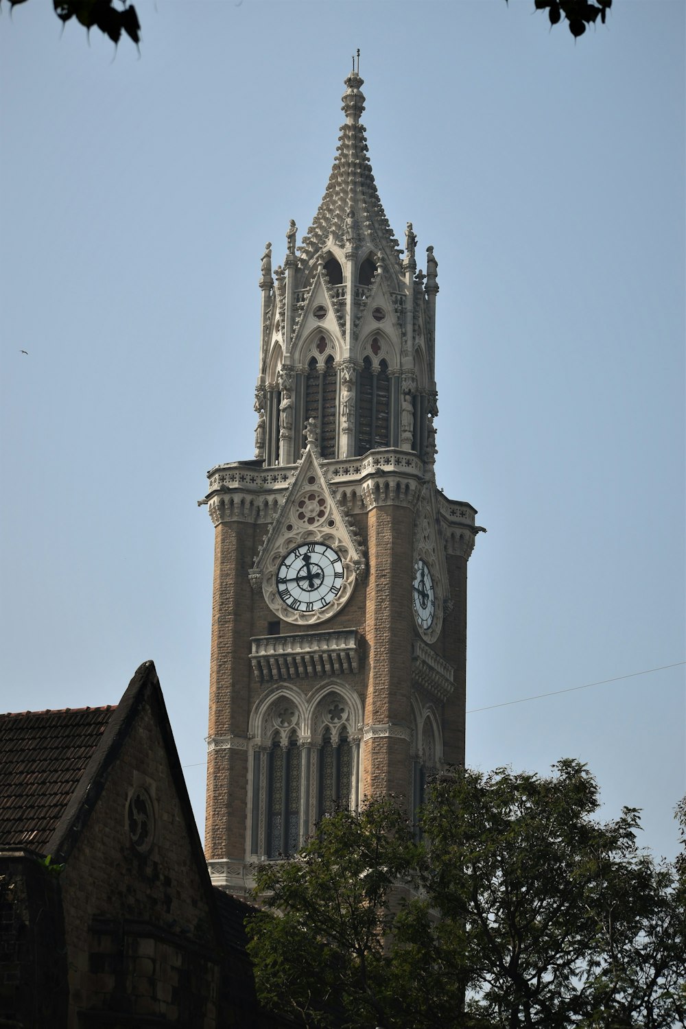 a tall tower with a clock on the top of it