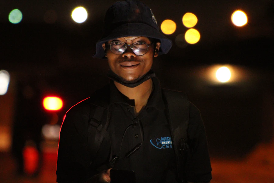 Event security staff managing a crowd entry lane at a venue