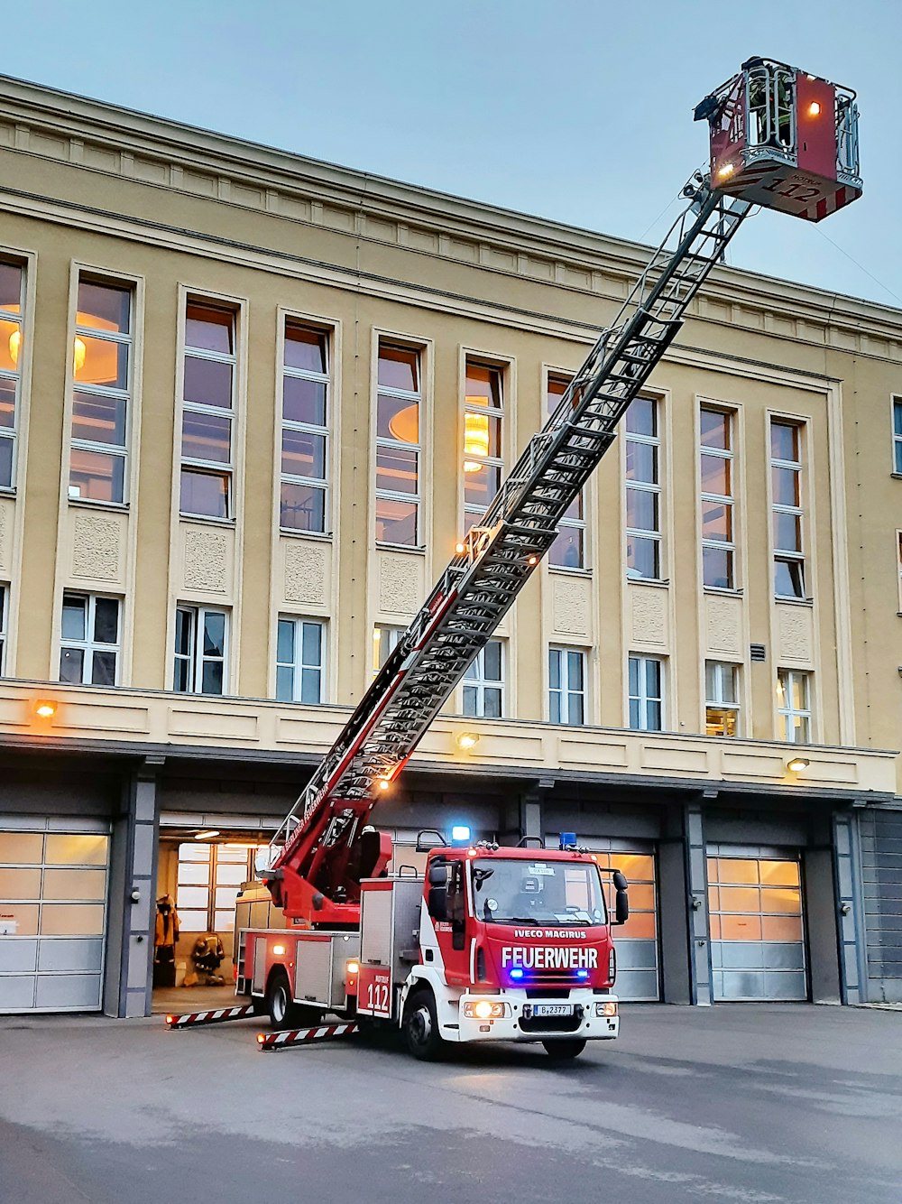 a fire truck parked in front of a fire station