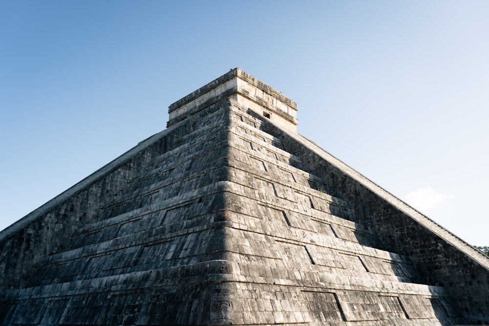 a very tall pyramid with a sky in the background