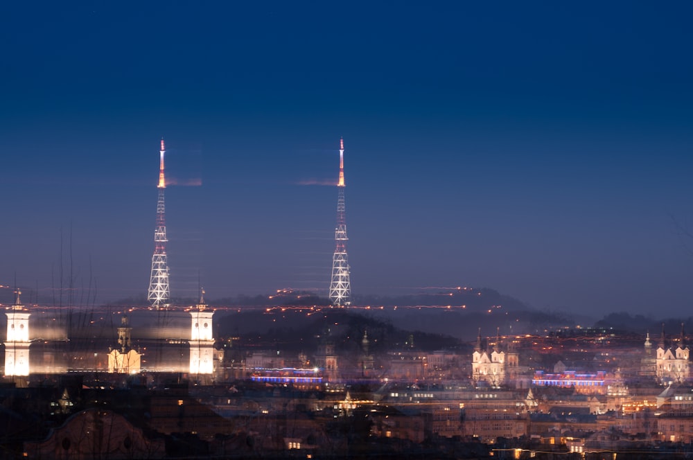 a view of a city at night from a hill