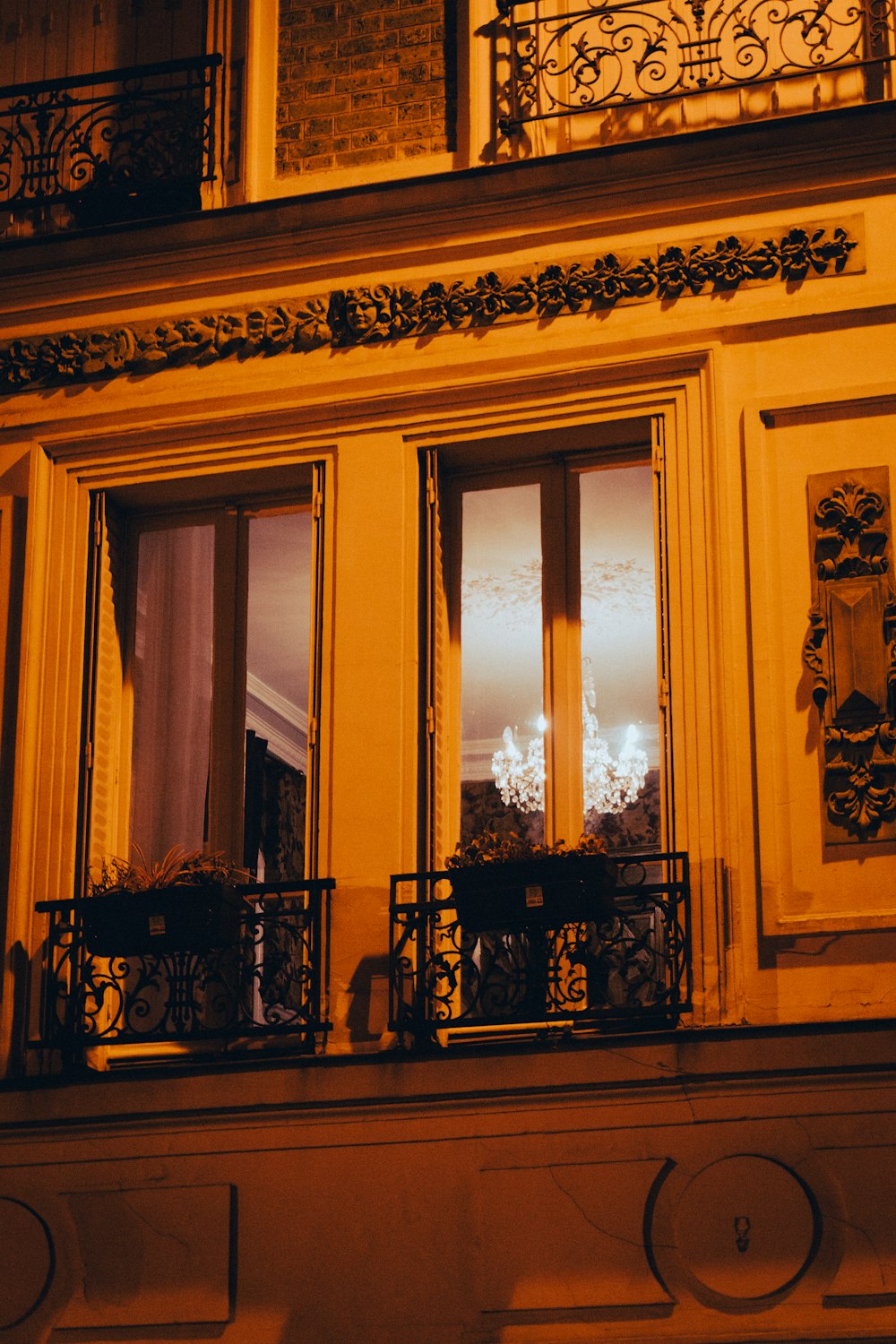 a building with a balcony and two windows