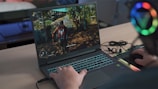 a person playing a video game on a laptop
