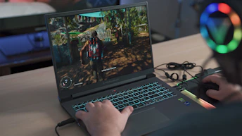 a person playing a video game on a laptop