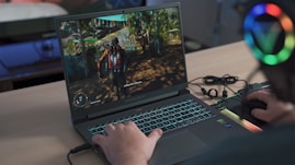 a person playing a video game on a laptop