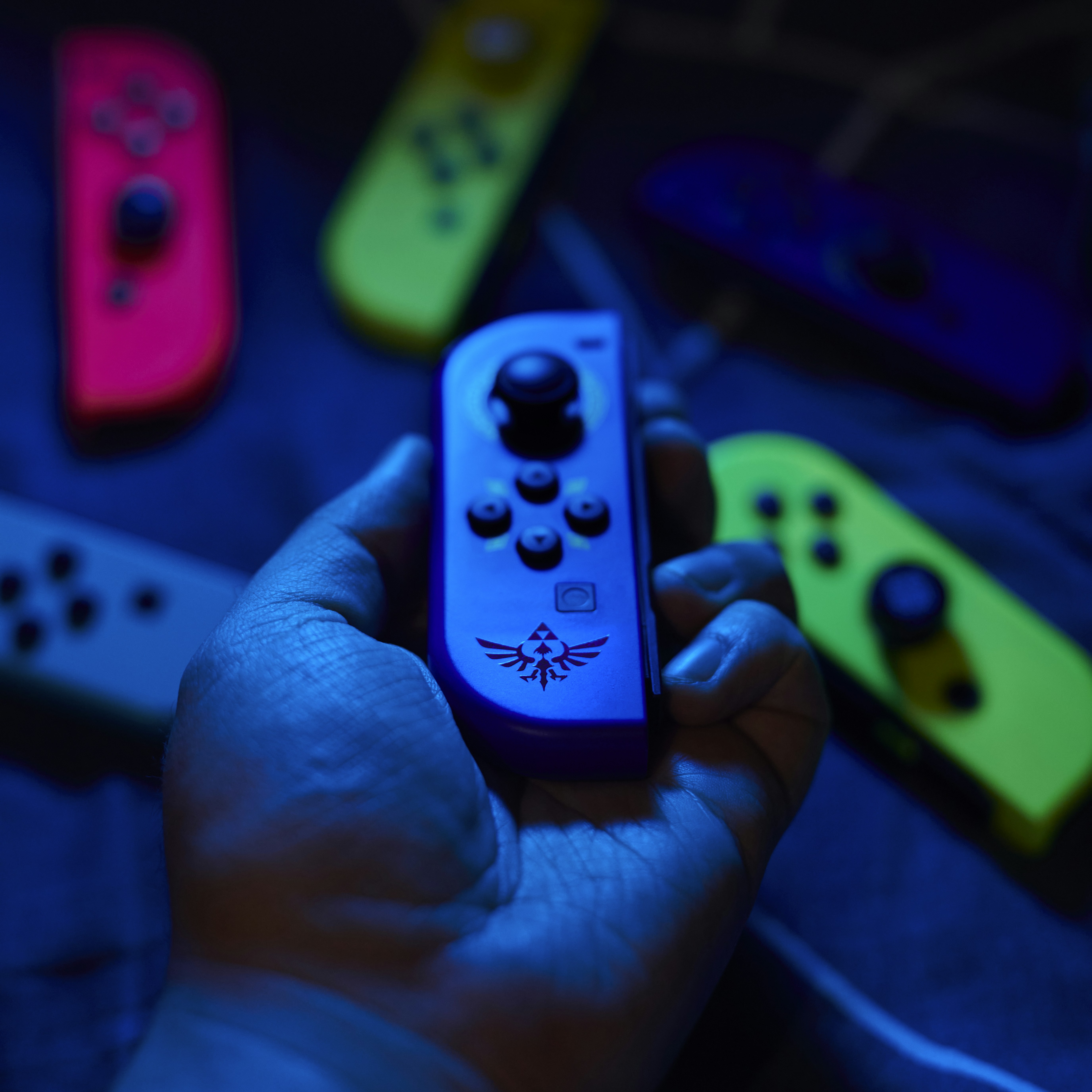 a person holding a nintendo wii controller in their hand