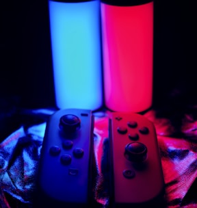 three video game controllers sitting next to each other