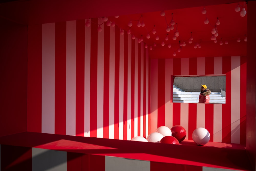 a room with red and white striped walls