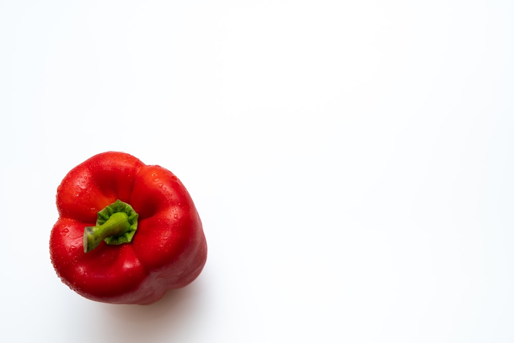 a red pepper on a white background