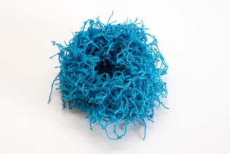 A playful doodle of a brain tangled in yarn, symbolizing anxiety with a humorous twist.