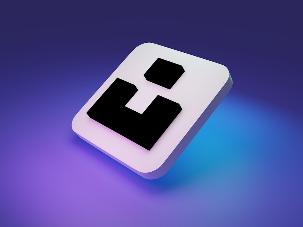 a black and white square button on a purple and blue background