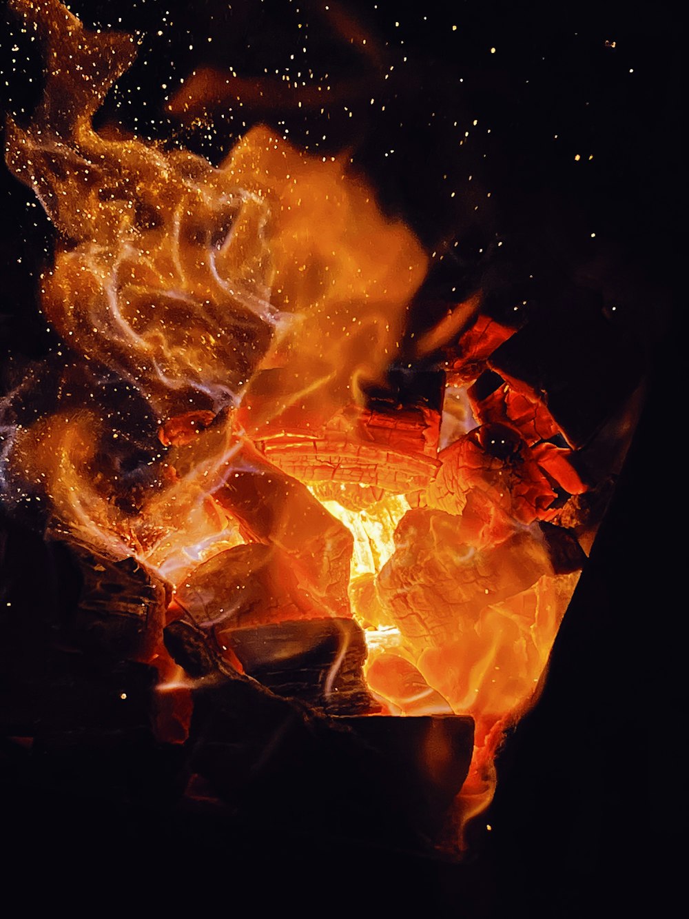 a close up of a fire in the dark