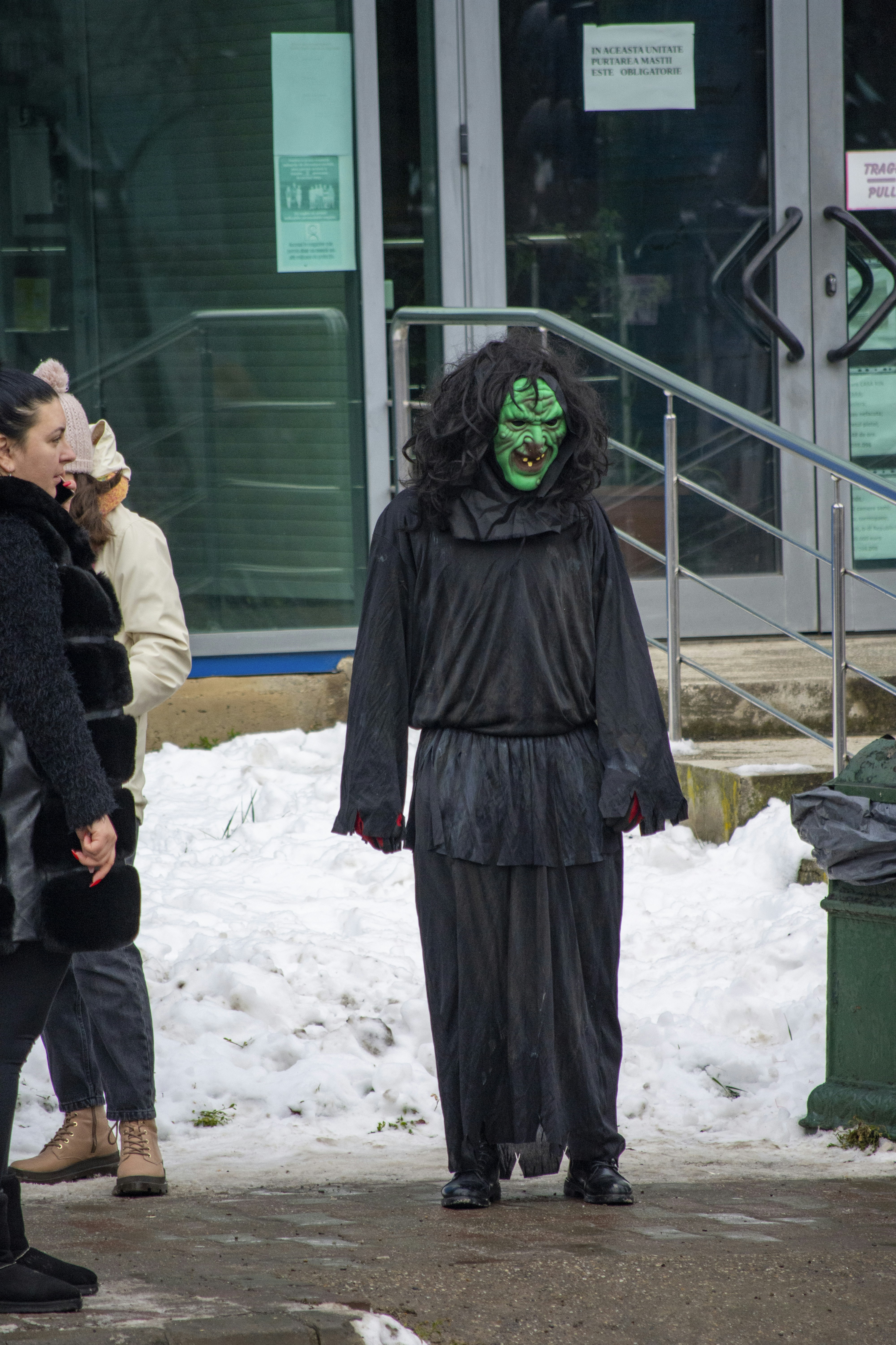 a man in a costume walking down the street