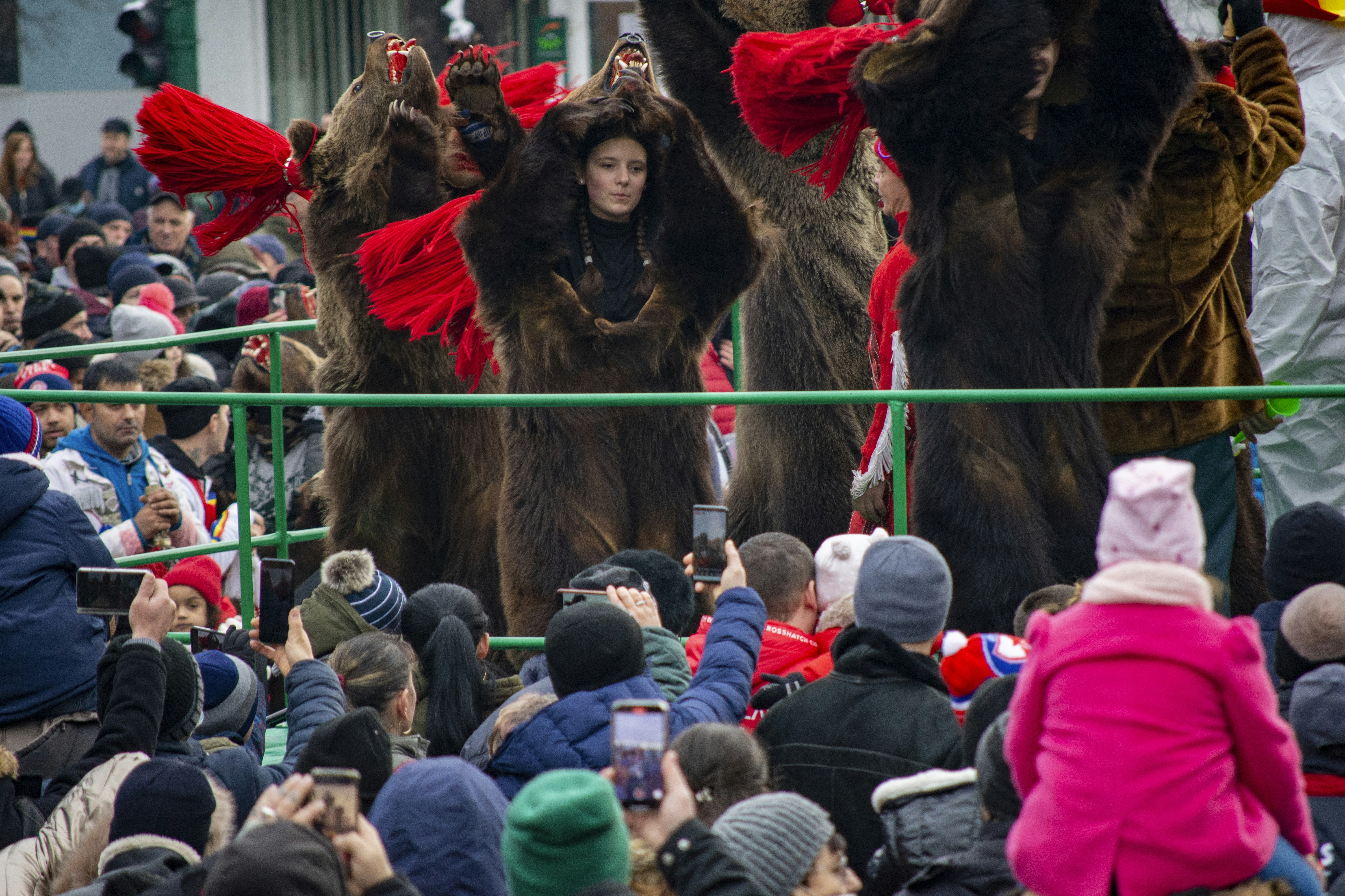 a group of people standing on top of a street