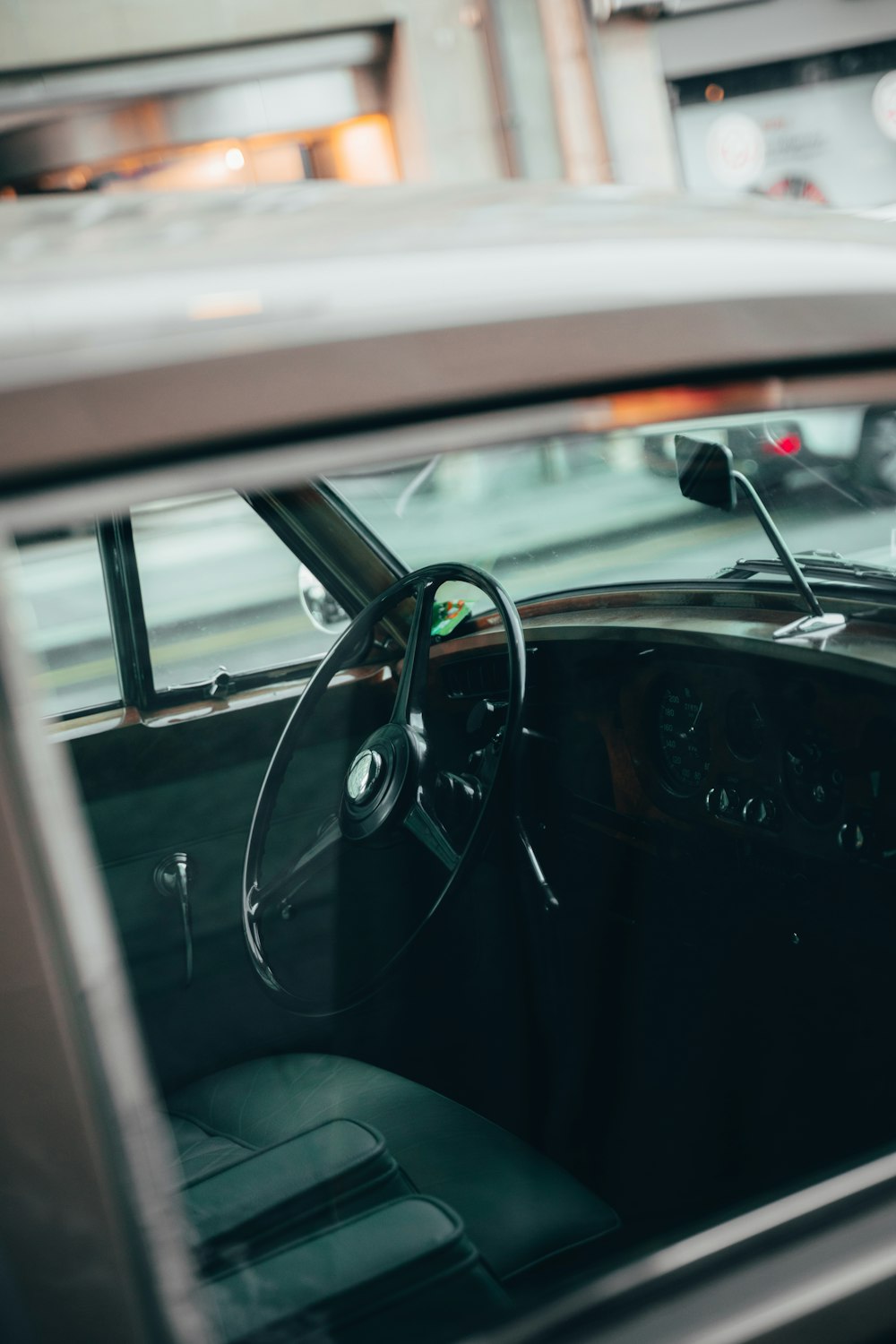 the interior of a car with a steering wheel and dashboard