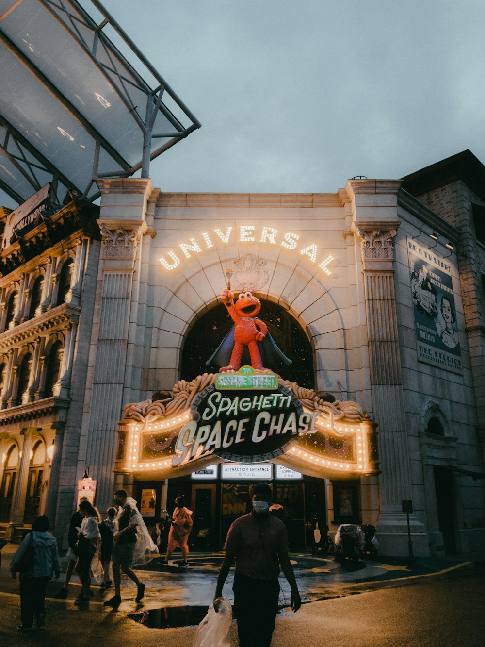 a man is walking in front of a theater