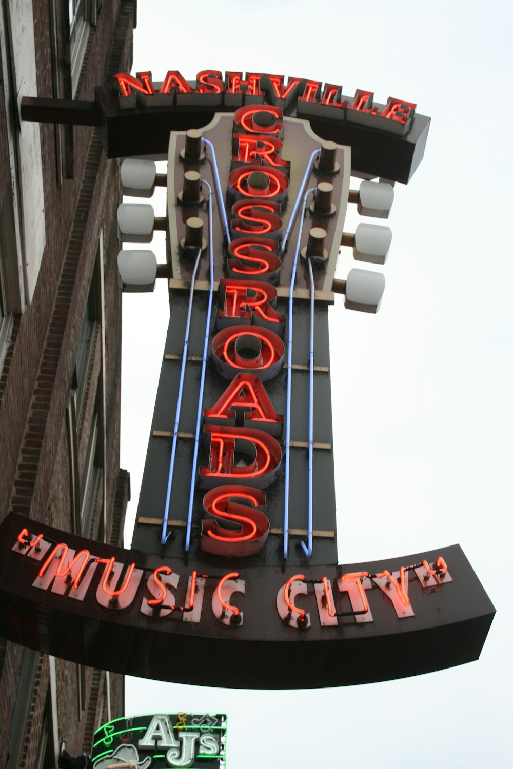 a large neon sign on the side of a building