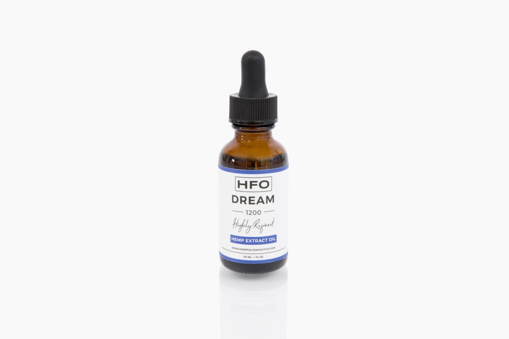 a bottle of hfo cream on a white background