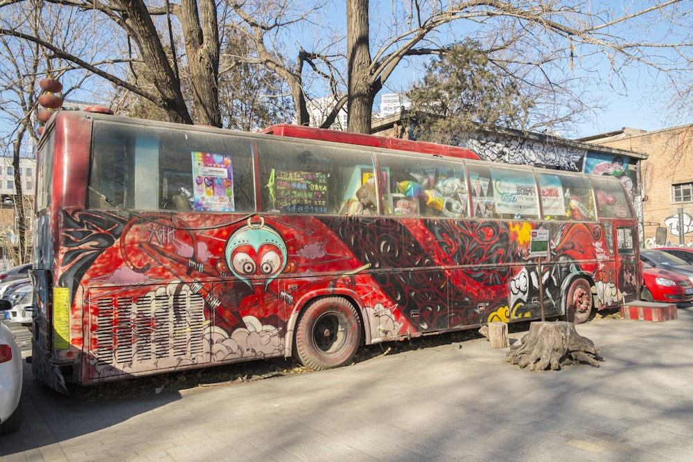 a red bus parked on the side of the road