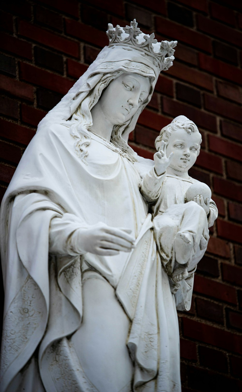 a statue of a woman holding a child