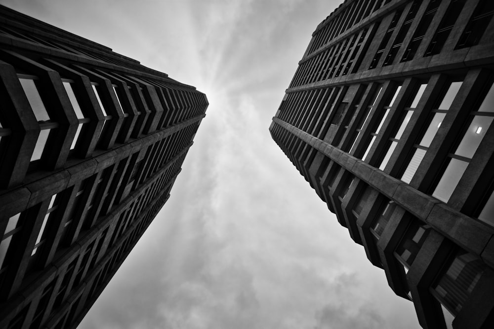 a black and white photo of two tall buildings