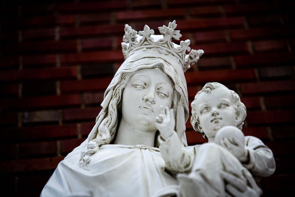 a statue of a woman holding a child